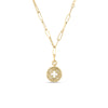 Gold necklace with a round pendant on a white background