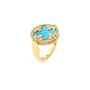 The VENETIAN MEDALLIONS MEDIUM REVERSIBLE RING by Roberto Coin features 18K yellow gold with a round turquoise center, diamond-studded floral motifs, and a twisted border, showcased against a plain white background.