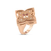 The VENETIAN PRINCESS PIROUETTE MEDIUM FLOWER RING by Roberto Coin features a rose gold flower-shaped design with sparkling diamonds and a polished finish, offering modern elegance against a plain white background.