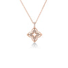 The VENETIAN PRINCESS PIROUETTE PAVE SMALL FLOWER NECKLACE by Roberto Coin features an 18K rose gold four-petal flower pendant with pave diamonds, delicately suspended from a fine chain against a white background.