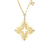 The VENETIAN PRINCESS PIROUETTE LARGE FLOWER NECKLACE by Roberto Coin features an ornate 18K gold four-petal pendant with diamond accents on an elongated link chain, plus a matching charm near the clasp, exemplifying Italian craftsmanship.