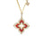 The VENETIAN PRINCESS PIROUETTE LARGE FLOWER NECKLACE by Roberto Coin features a red enamel four-petal floral pendant outlined with diamonds on an 18K gold chain, highlighting Italian craftsmanship.