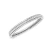 The SIENA DIAMOND 1 ROW BANGLE by Roberto Coin is an elegant white gold or platinum bangle featuring a single row of sparkling round-cut diamonds and intricate edge detailing, showcased on a plain white background.